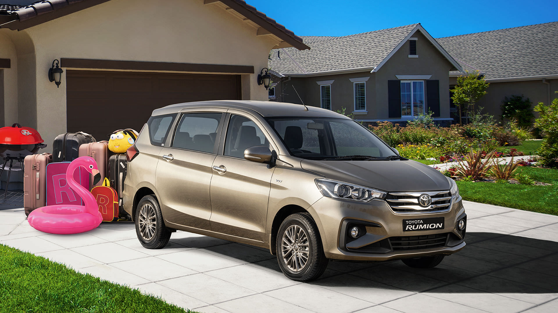 gold Toyota Rumion parked outside of suburban home with luggage